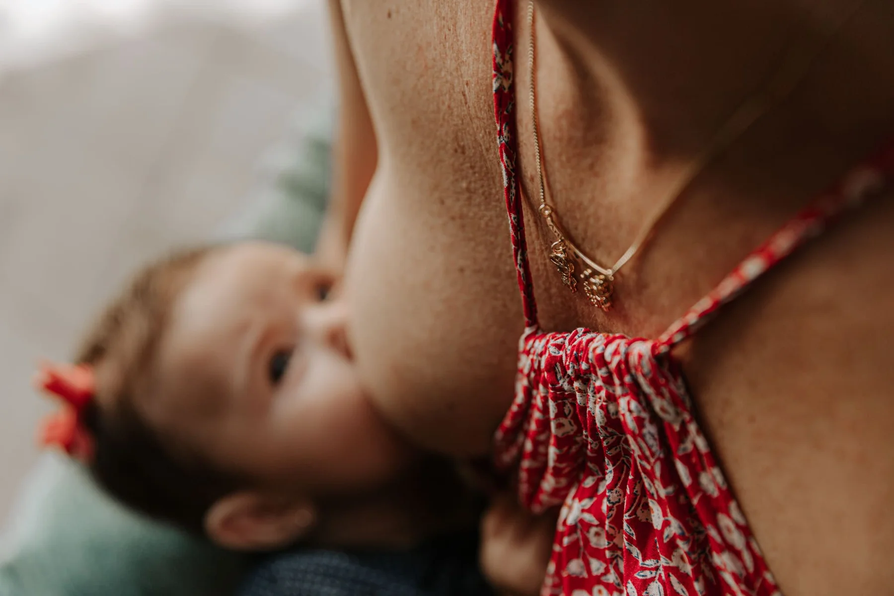 Close up of a mother nursing her baby in soft light